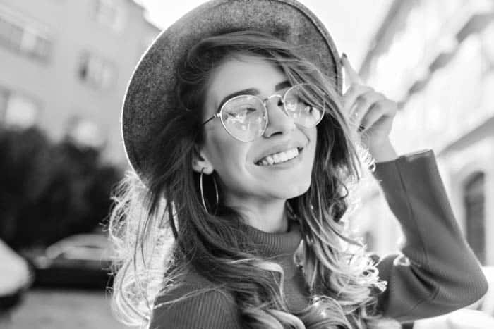 Fair Lakes Family Cosmetic Dentistry Happy Young Woman Glasses Outside
