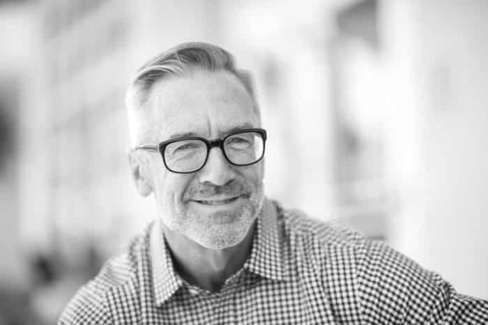 Fair Lakes Family Cosmetic Dentistry Older Man Happy tooth extractions